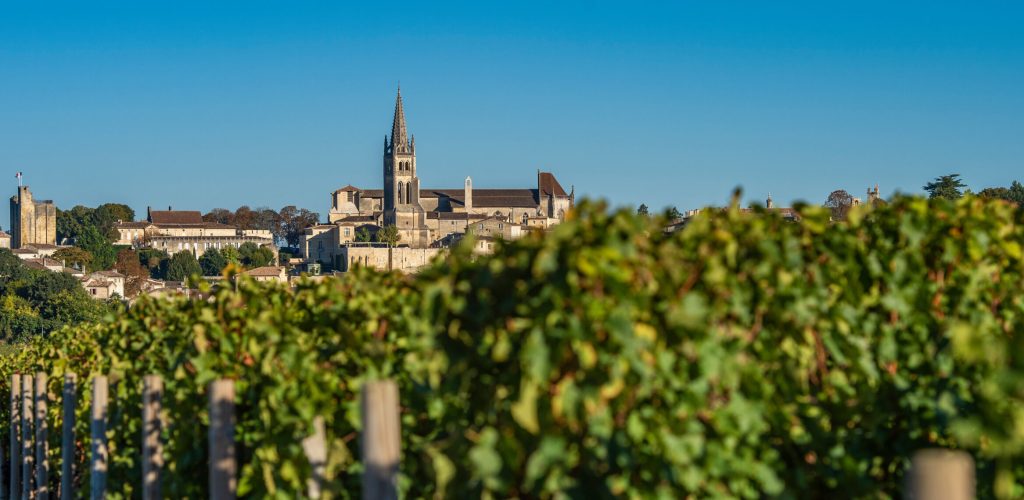 Beautiful sunrise on the steeple of the church and village of Saint Emilion, Religion, Gironde, France, Europe